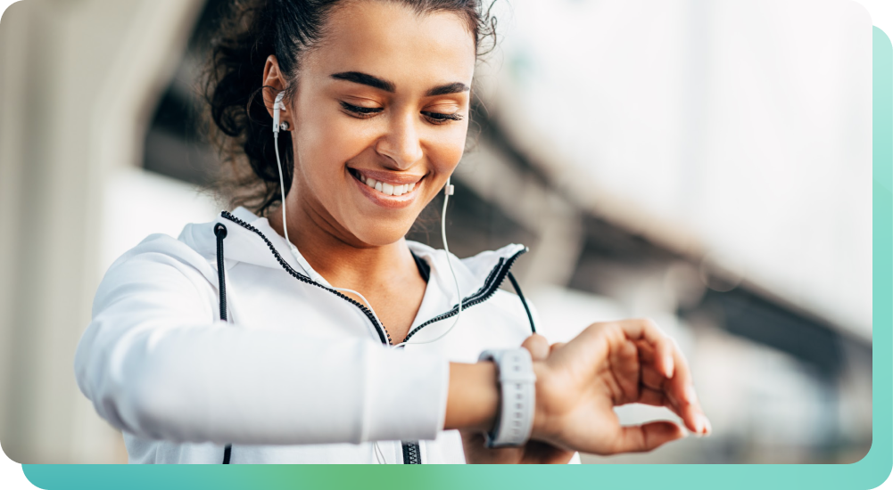 woman listening to workout music with smart watch